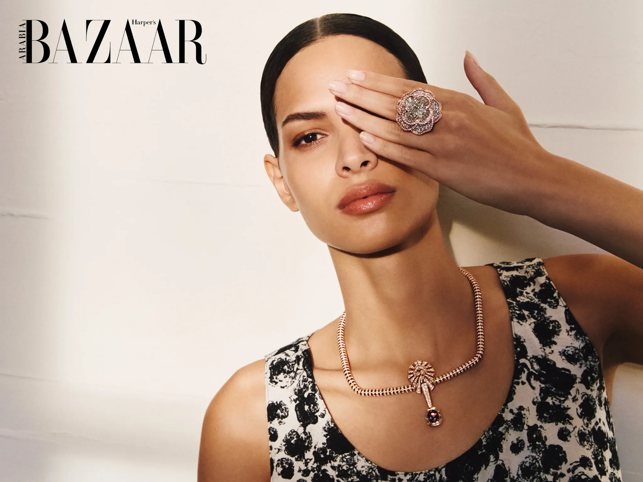 Symbole Camélia Rose Ring in Platinum and Rose Gold with Diamonds and Pink Sapphires; Lion Rubis Necklace in Rose Gold with a Ruby and Diamonds, POA, both Chanel High Jewellery